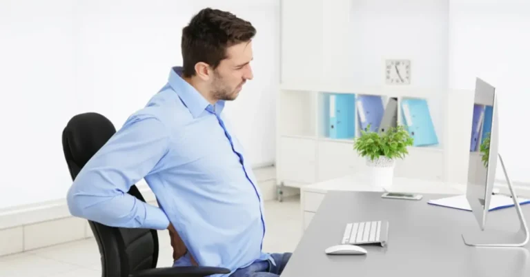 a peron experiencing back pain while using regular office chair nulife