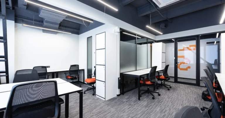 Modern office space with ergonomic chairs and desks, featuring a clean and minimal design. - are ergonomic chairs worth it